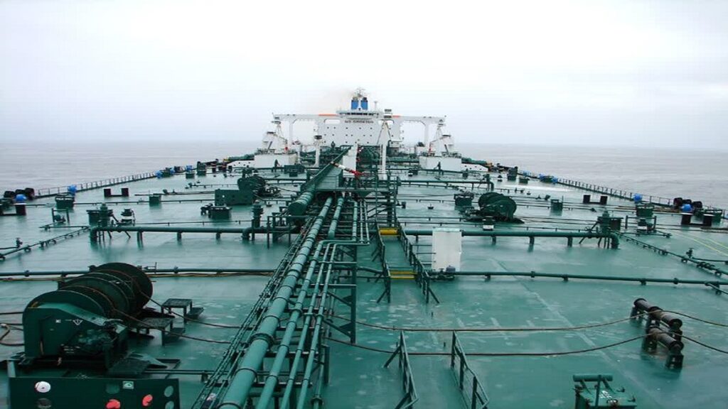 Oil tanker equipment arrangement showing cargo-deck piping, valves, and deck machinery viewed looking aft